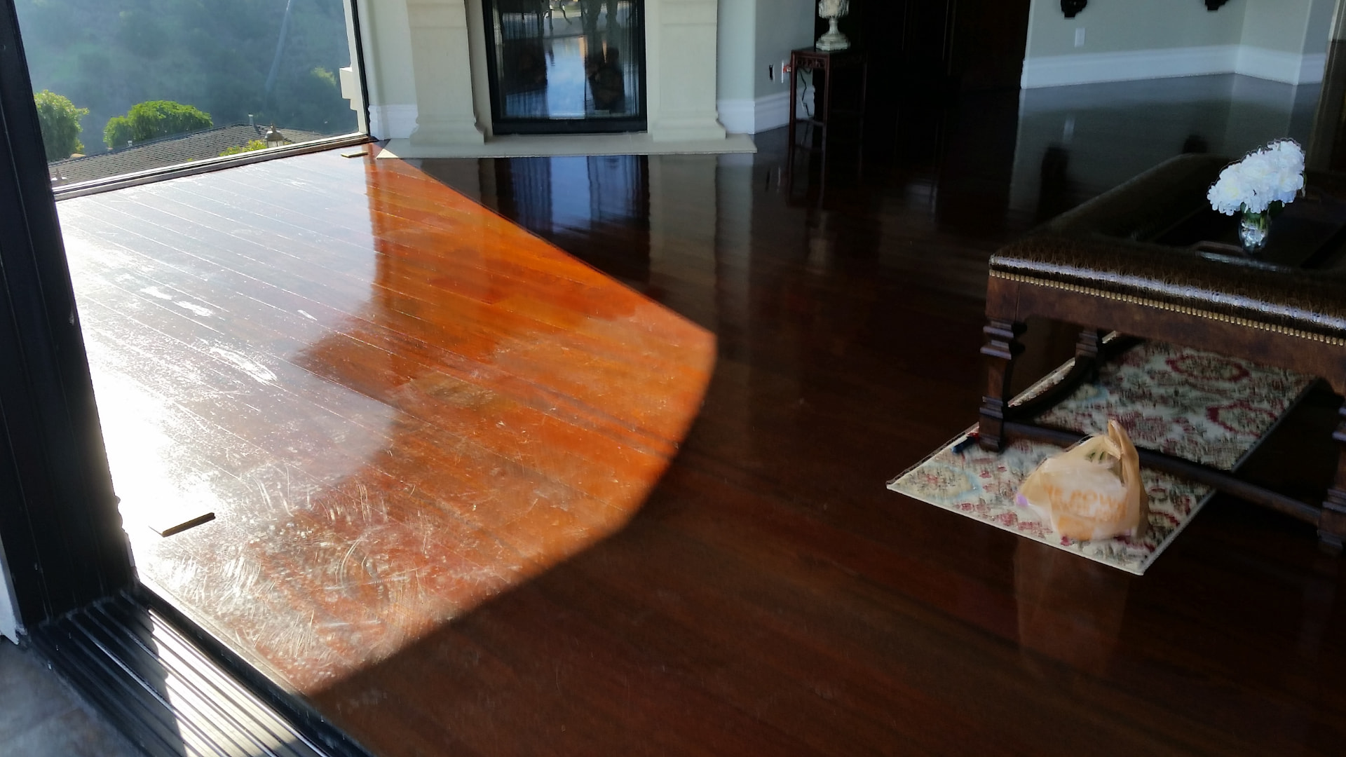 Worn hardwood floor before refinishing