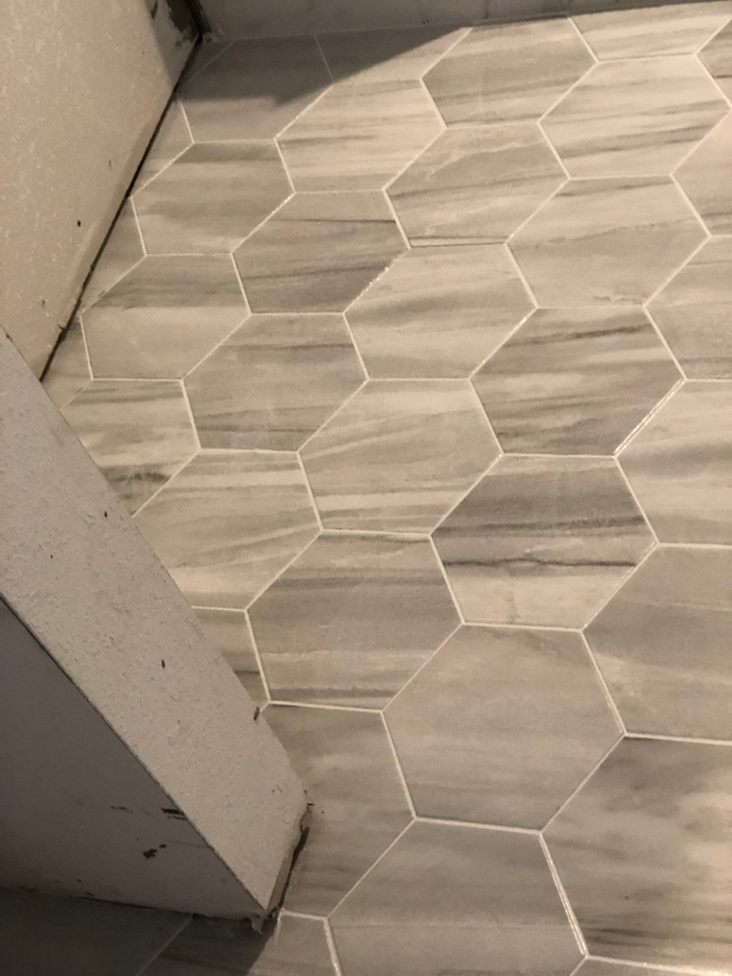 Completed gray and white hexagonal tile floor